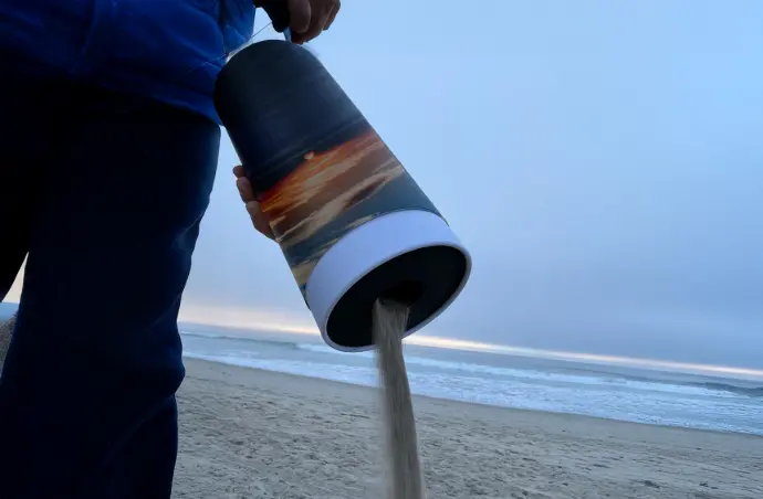 Image of someone emptying the contents of a scattering tube